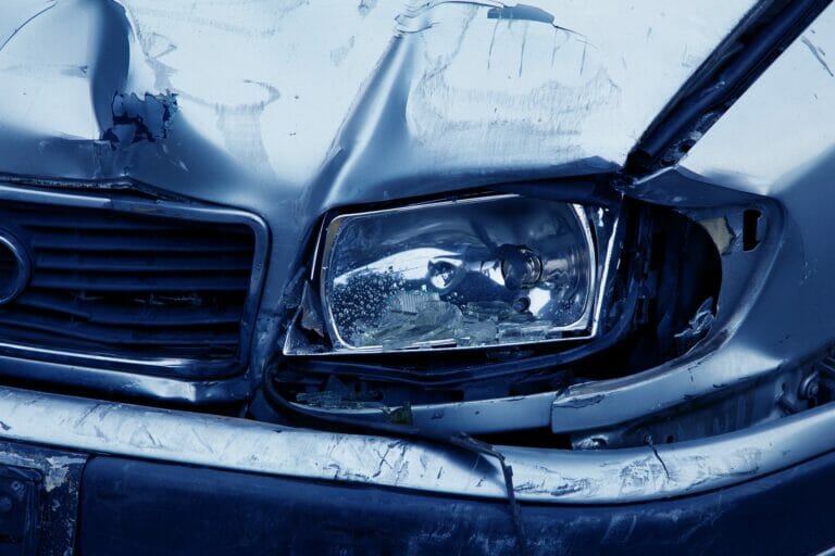 Injured Florida driver reviewing medical bills and missed work paperwork after a car accident