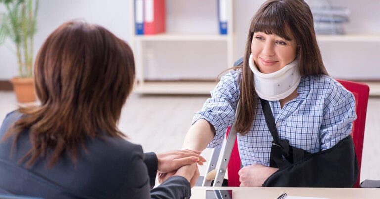 Attorney reviewing medical bills with a injured client