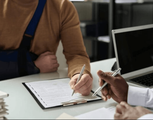 Medical bills and insurance paperwork being reviewed during a consultation