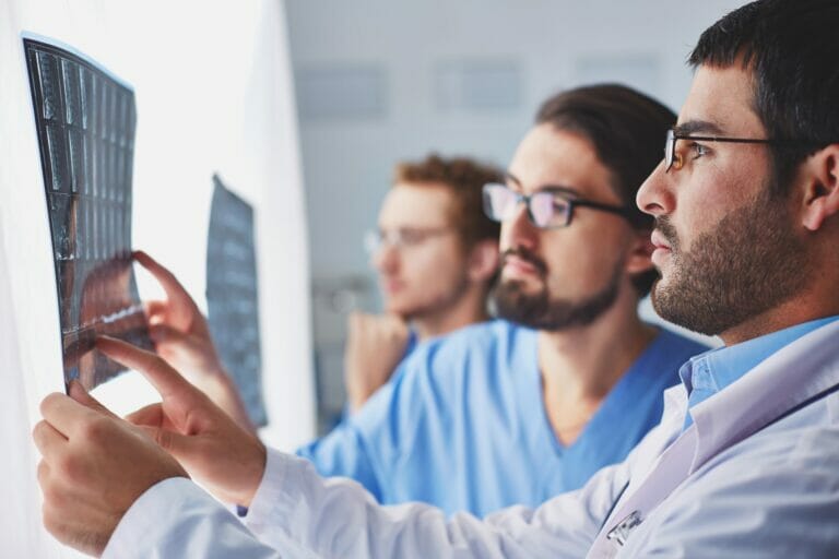 Patient discussing spinal pain treatment options with a medical provider after an injury