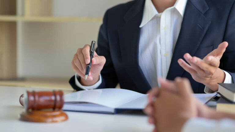 Tax documents and settlement paperwork on a desk